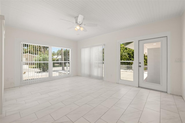 spare room with light tile patterned floors and ceiling fan