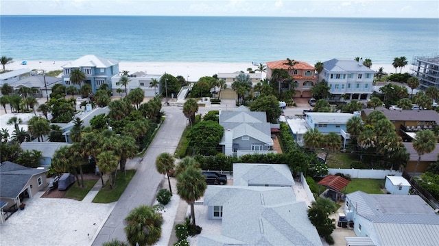 bird's eye view with a beach view and a water view