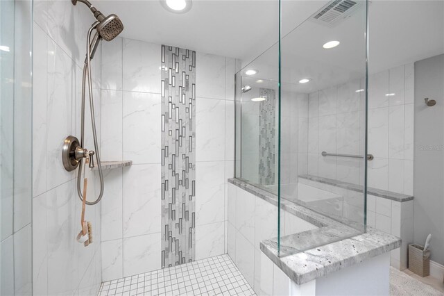 bathroom with a tile shower