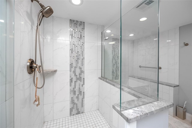 full bathroom with visible vents, tiled shower, and recessed lighting