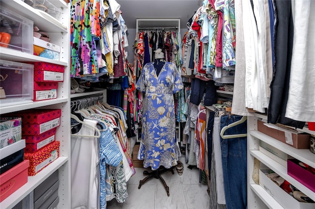 walk in closet with tile patterned floors