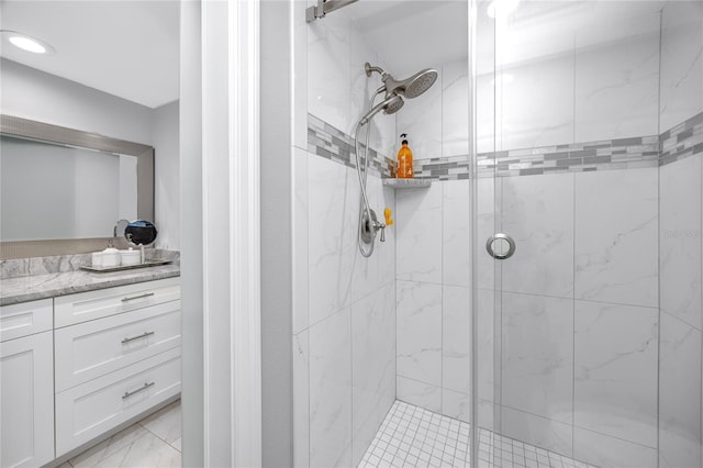 bathroom with a stall shower and vanity