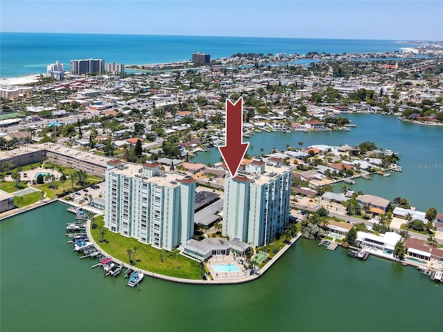 drone / aerial view featuring a water view and a view of city