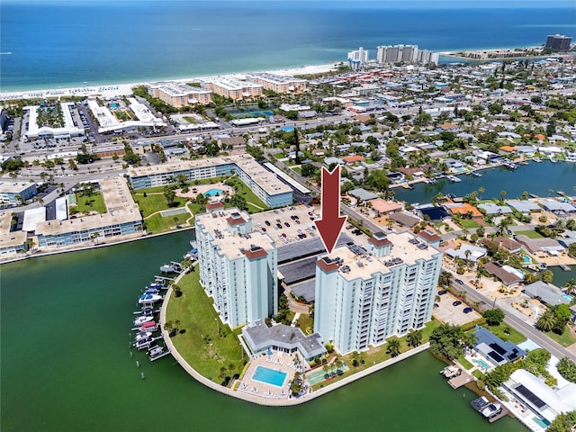 birds eye view of property with a water view and a city view