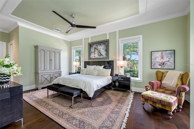 bedroom with multiple windows, hardwood / wood-style flooring, and ornamental molding