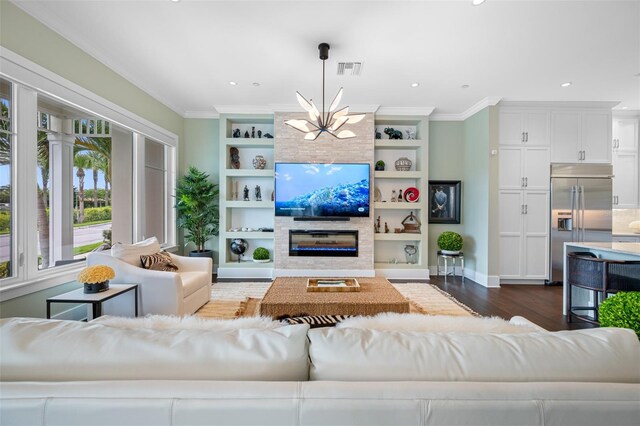 6 Hibiscus Ln, Belleair, FL 33756 - living room featuring a chandelier, dark wood finished floors, ornamental molding, built in features, and baseboards