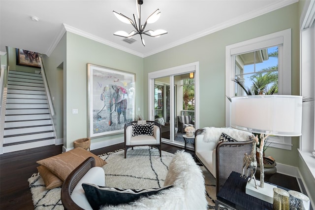 6 Hibiscus Ln, Belleair, FL 33756 - living area with crown molding, a chandelier, wood finished floors, stairs, and healthy amount of natural light