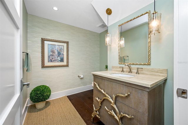 6 Hibiscus Ln, Belleair, FL 33756 - bathroom with baseboards, vanity, wood finished floors, and recessed lighting