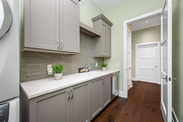 6 Hibiscus Ln, Belleair, FL 33756 - kitchen with gray cabinets, fridge, a sink, dark wood-style floors, and backsplash