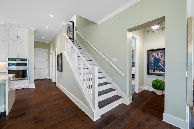 stairway featuring wood-type flooring and ornamental molding