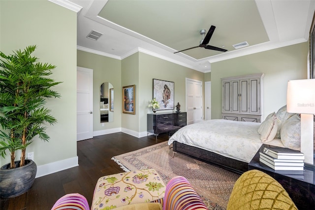 bedroom with crown molding, dark wood-type flooring, and ceiling fan