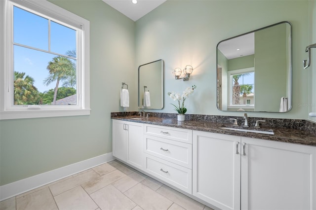 6 Hibiscus Ln, Belleair, FL 33756 - full bathroom with baseboards, double vanity, and recessed lighting