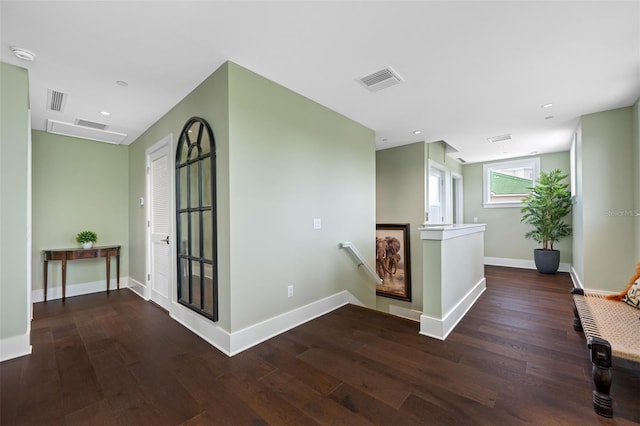 hallway with dark wood-type flooring