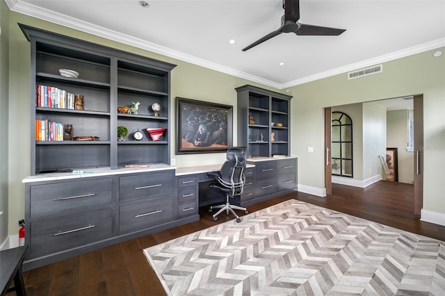 unfurnished office with crown molding, ceiling fan, and dark hardwood / wood-style flooring