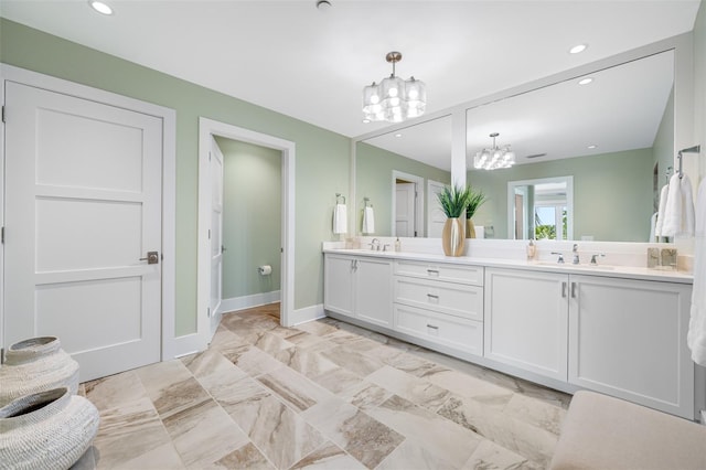 6 Hibiscus Ln, Belleair, FL 33756 - full bath with a chandelier, double vanity, baseboards, recessed lighting, and marble finish floors