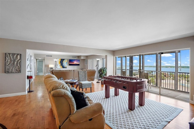 game room featuring light wood-type flooring