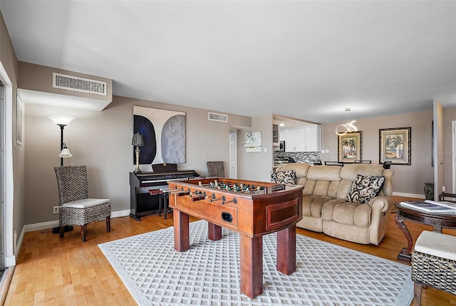 game room featuring light hardwood / wood-style floors