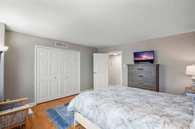 bedroom featuring light hardwood / wood-style flooring and a closet