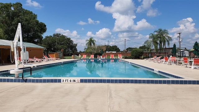 view of swimming pool with a patio area