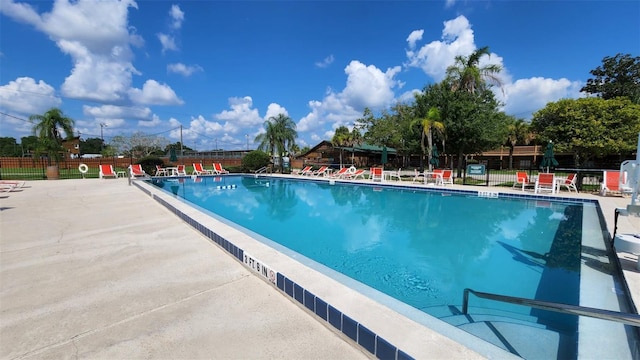 view of swimming pool with a patio