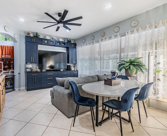 tiled dining area featuring ceiling fan and a healthy amount of sunlight