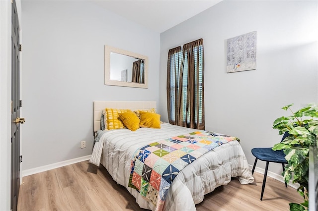 bedroom with light hardwood / wood-style floors