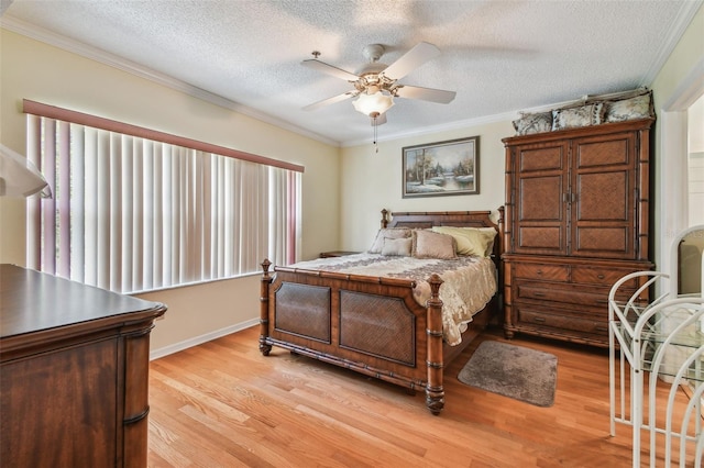 bedroom featuring ceiling fan, ornamental molding, a textured ceiling, and light hardwood / wood-style flooring