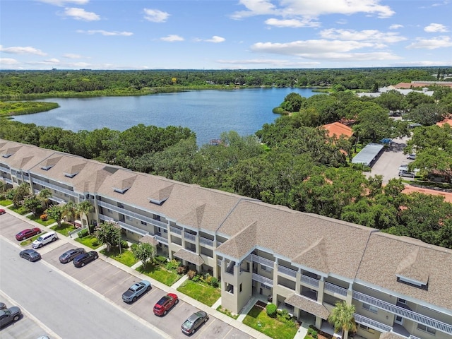 birds eye view of property with a water view