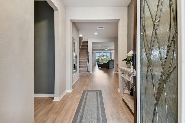 hall with light hardwood / wood-style flooring