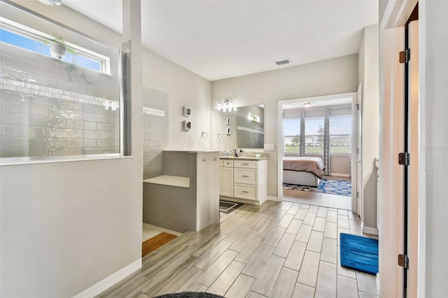 bathroom featuring vanity and wood-type flooring