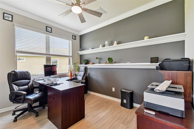 office space featuring ornamental molding, ceiling fan, and light hardwood / wood-style floors