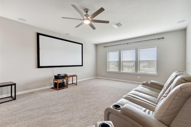 home theater with carpet and ceiling fan