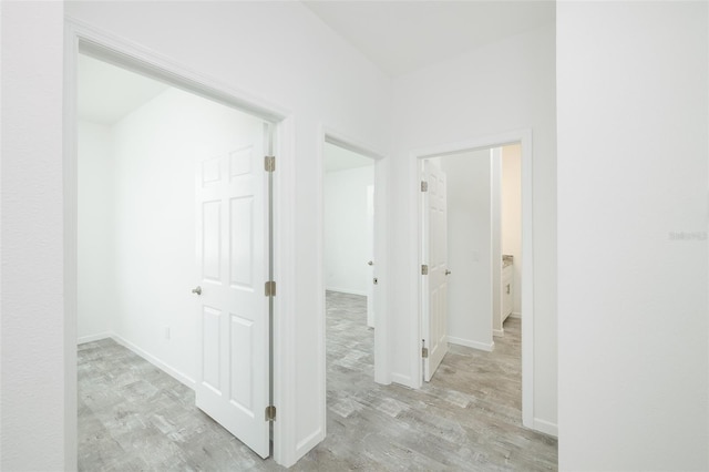 corridor featuring light hardwood / wood-style floors