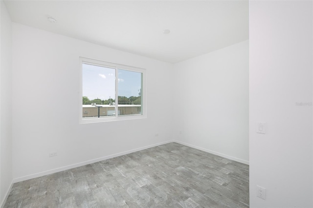 unfurnished room with light hardwood / wood-style flooring