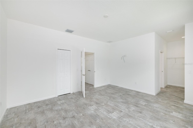 unfurnished room featuring light wood-type flooring