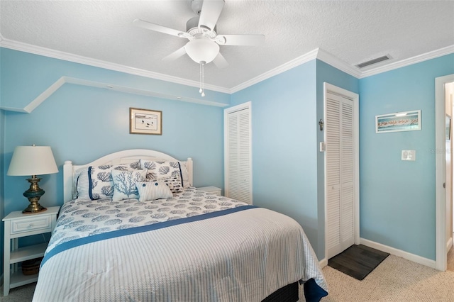 bedroom with a textured ceiling, ceiling fan, carpet, and crown molding