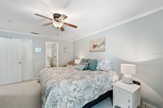 bedroom with connected bathroom, a closet, ornamental molding, ceiling fan, and light colored carpet