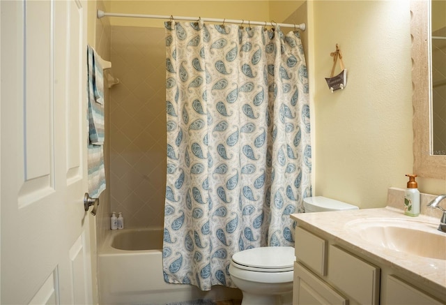 full bathroom with vanity, toilet, and shower / tub combo