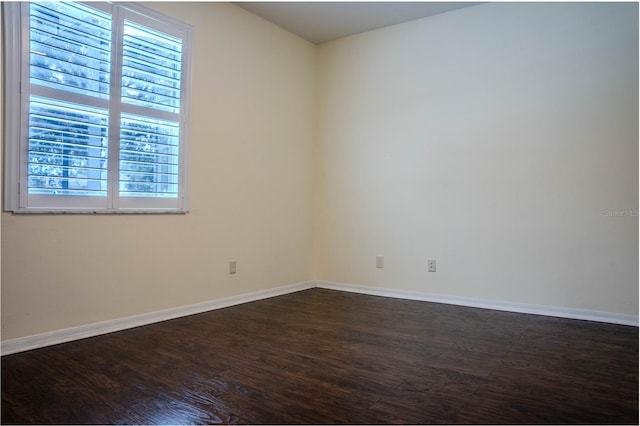 spare room with hardwood / wood-style floors