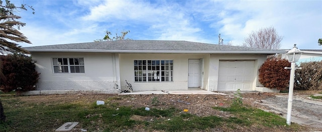 ranch-style home featuring a garage