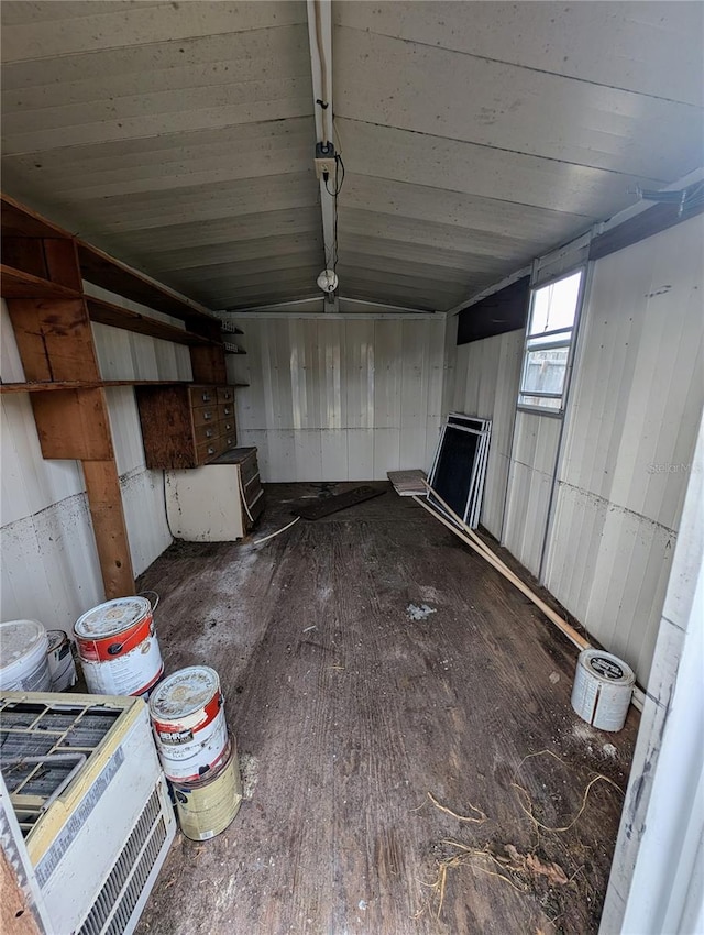 interior space with wood-type flooring and vaulted ceiling