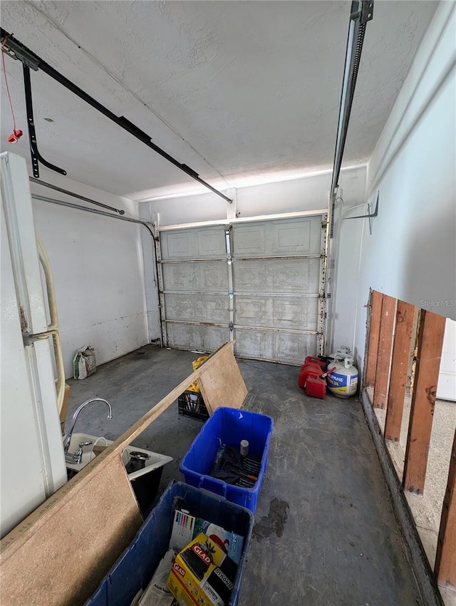 garage featuring white fridge