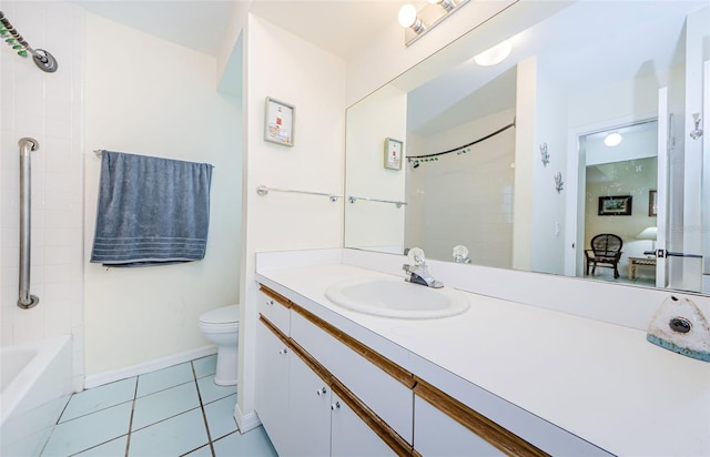 full bathroom featuring vanity, tiled shower / bath, tile patterned floors, and toilet