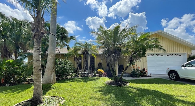 view of front of house with a garage and a front yard