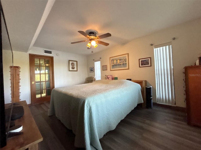 bedroom with ceiling fan and dark hardwood / wood-style floors