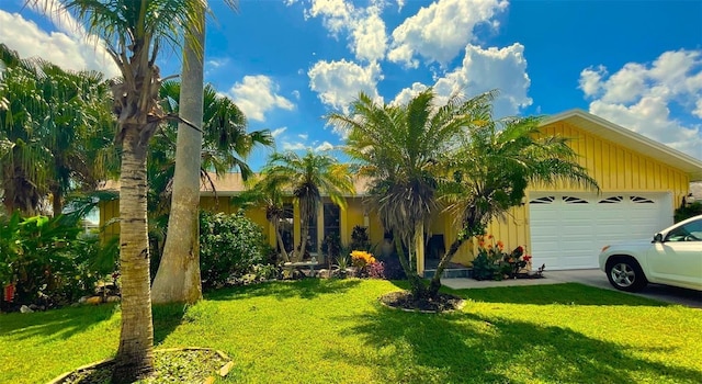 view of front of property with a garage and a front yard