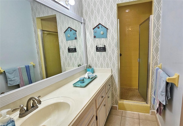 bathroom with vanity, tile patterned floors, and a shower with shower door