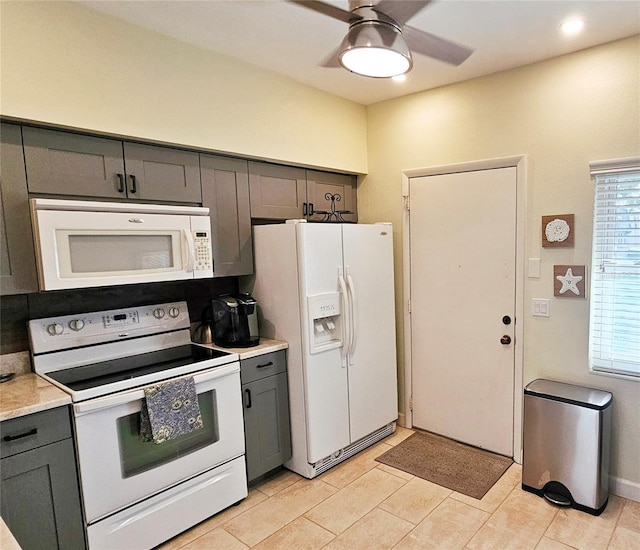 kitchen featuring ceiling fan, white appliances, and gray cabinets