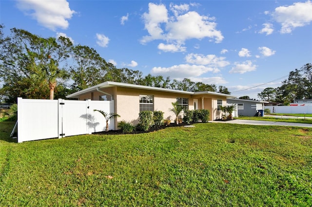 ranch-style home with a front yard