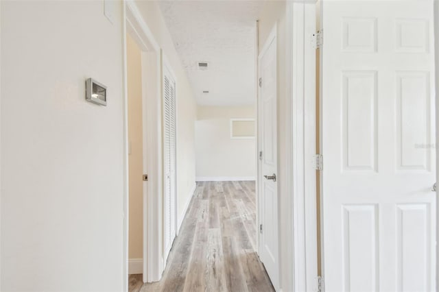 hallway featuring light hardwood / wood-style flooring